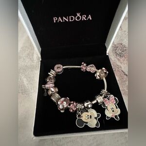 Pandora bracelet brand new never worn with Minnie and Mickey Mouse on it